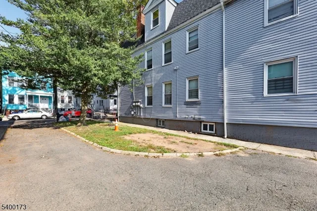 a swimming pool with outdoor seating and yard