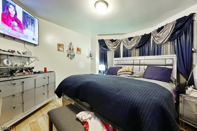 a bedroom with a bed and cabinets