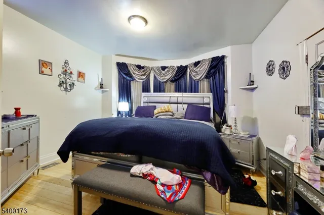 a bedroom with a bed and a closet