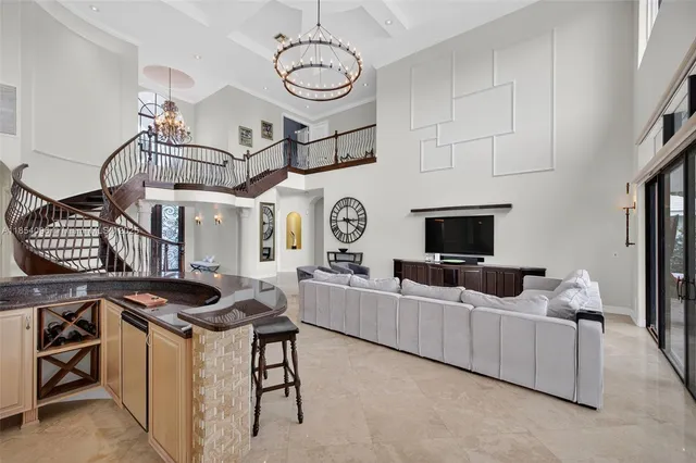 a view of a livingroom with furniture and a flat screen tv