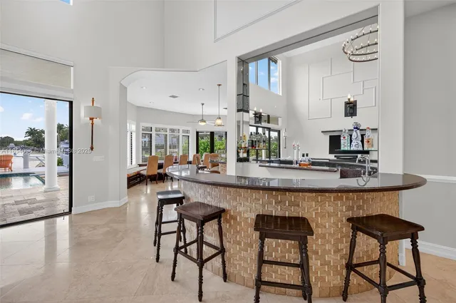 a large kitchen with a table and chairs