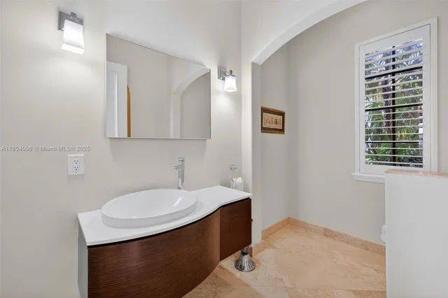 a spacious bedroom with a bed and a large window