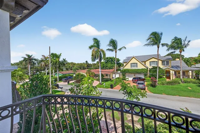 a bathroom with a granite countertop sink a toilet a mirror and shower