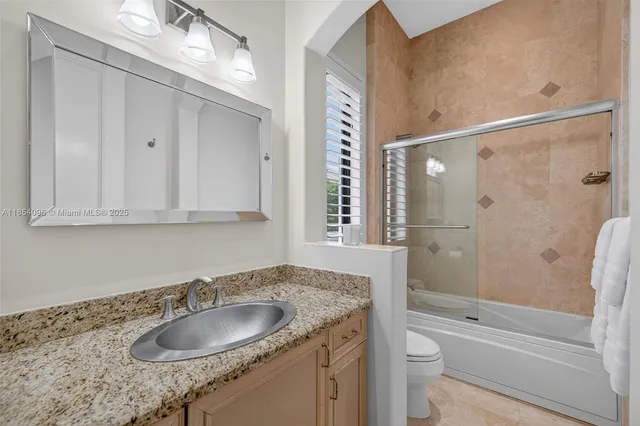 a view of a house with swimming pool and sitting area