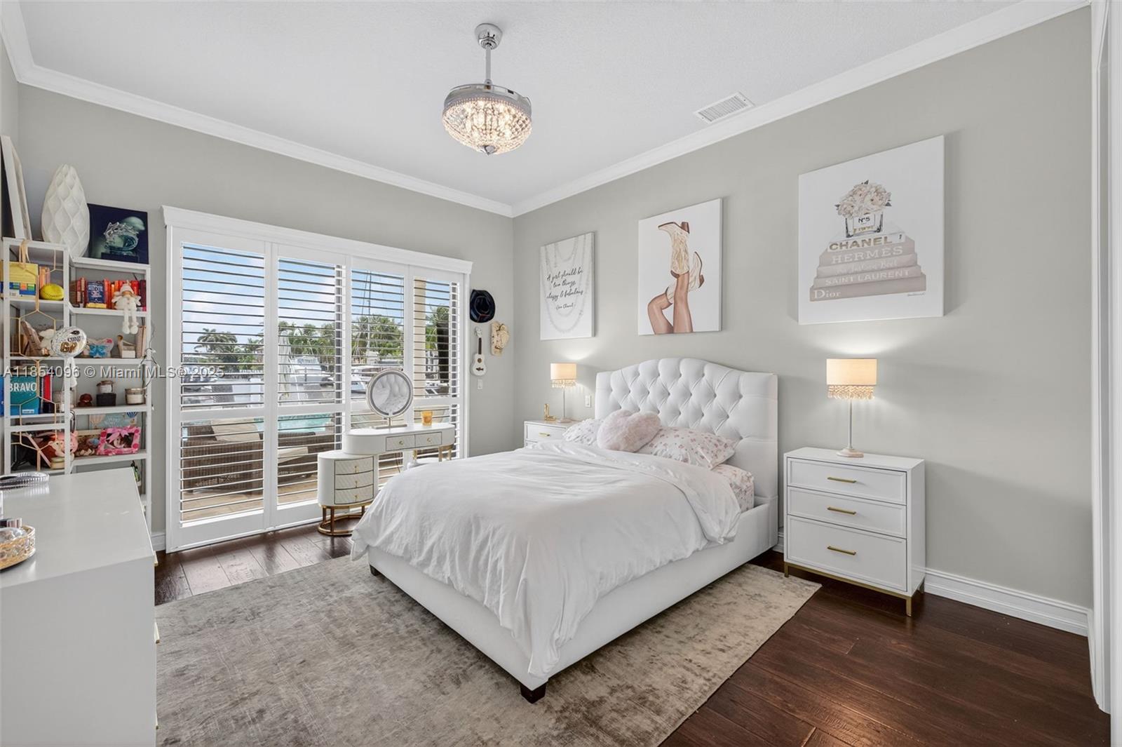 2649 Northeast 26th Avenue Lighthouse Point, FL 33064 - Photo 48 of 60 a bedroom with a large bed and a window