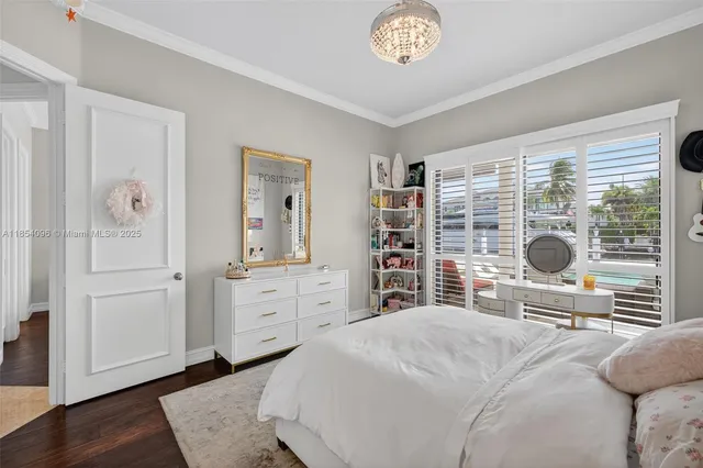 a front view of a house with a garden and yard