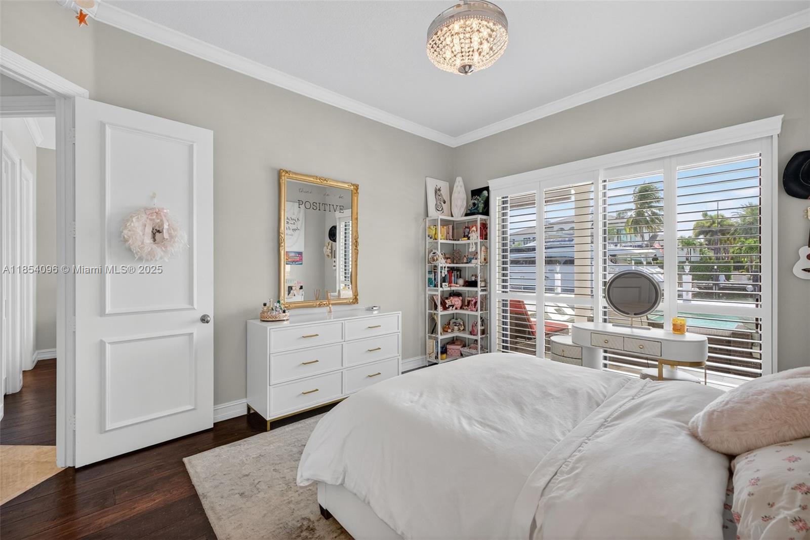 2649 Northeast 26th Avenue Lighthouse Point, FL 33064 - Photo 49 of 60 a bedroom with a bed and a large window