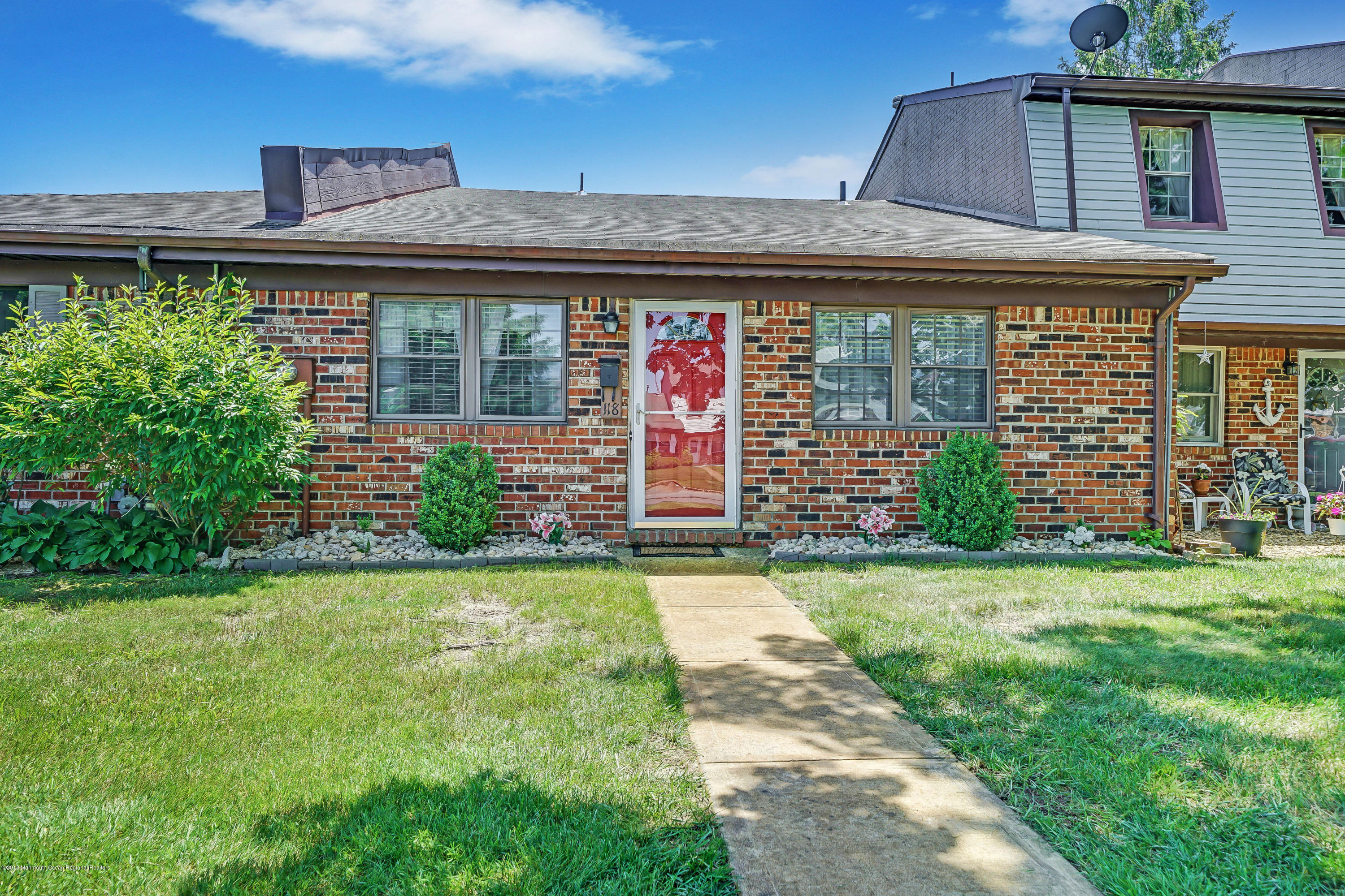 118 Greenwood Loop Road Brick, NJ 08724 - Photo 1 of 18 front view of a house with a yard
