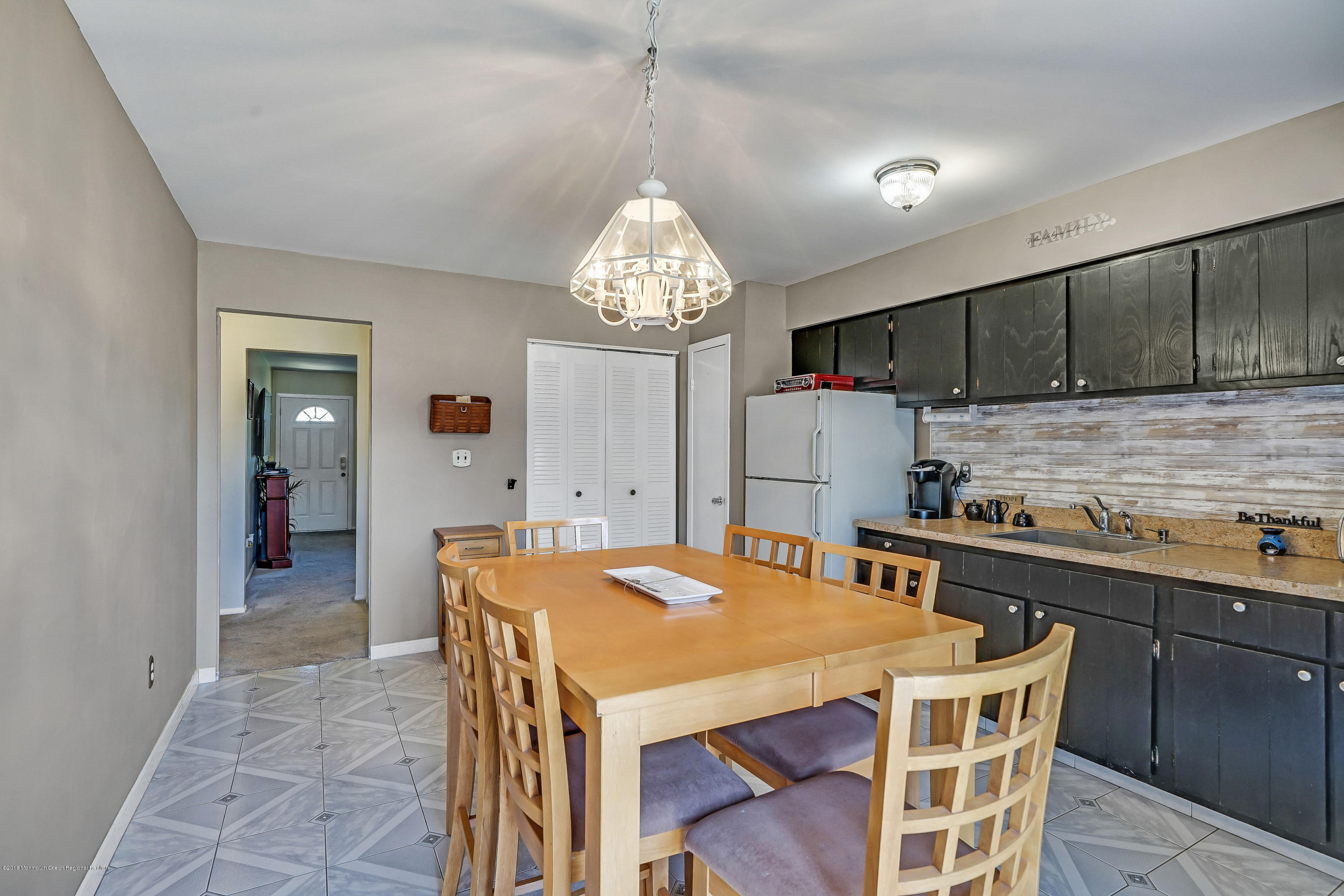 118 Greenwood Loop Road Brick, NJ 08724 - Photo 11 of 18 a kitchen that has a table and chairs in it