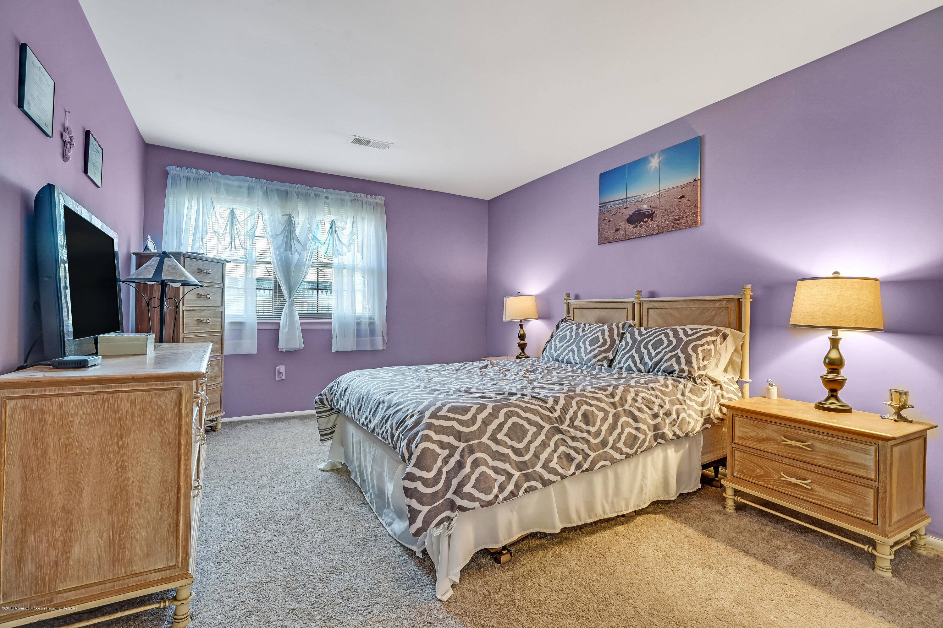 118 Greenwood Loop Road Brick, NJ 08724 - Photo 14 of 18 a bedroom with a bed and flat screen tv