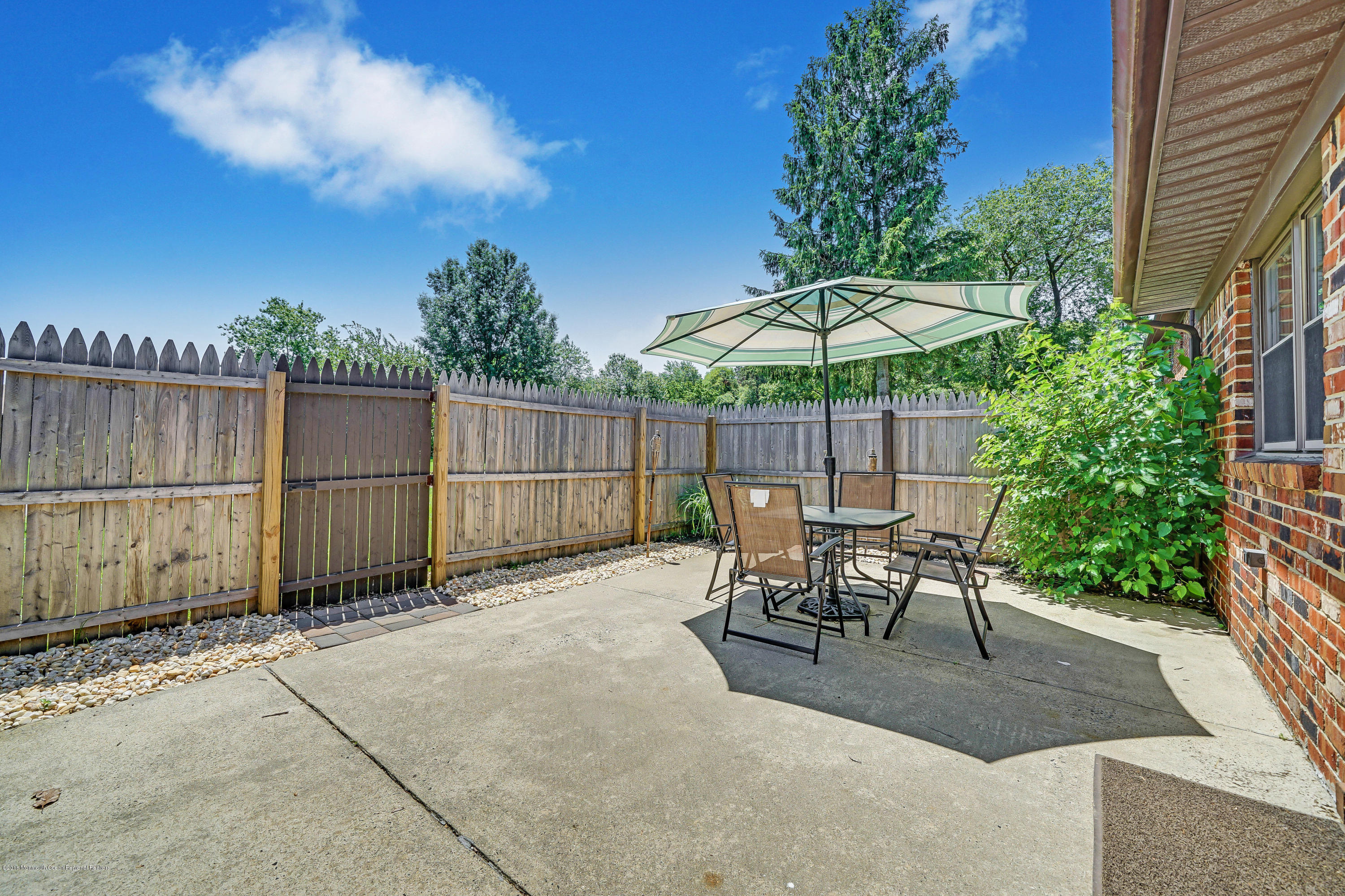 118 Greenwood Loop Road Brick, NJ 08724 - Photo 17 of 18 a view of backyard with patio