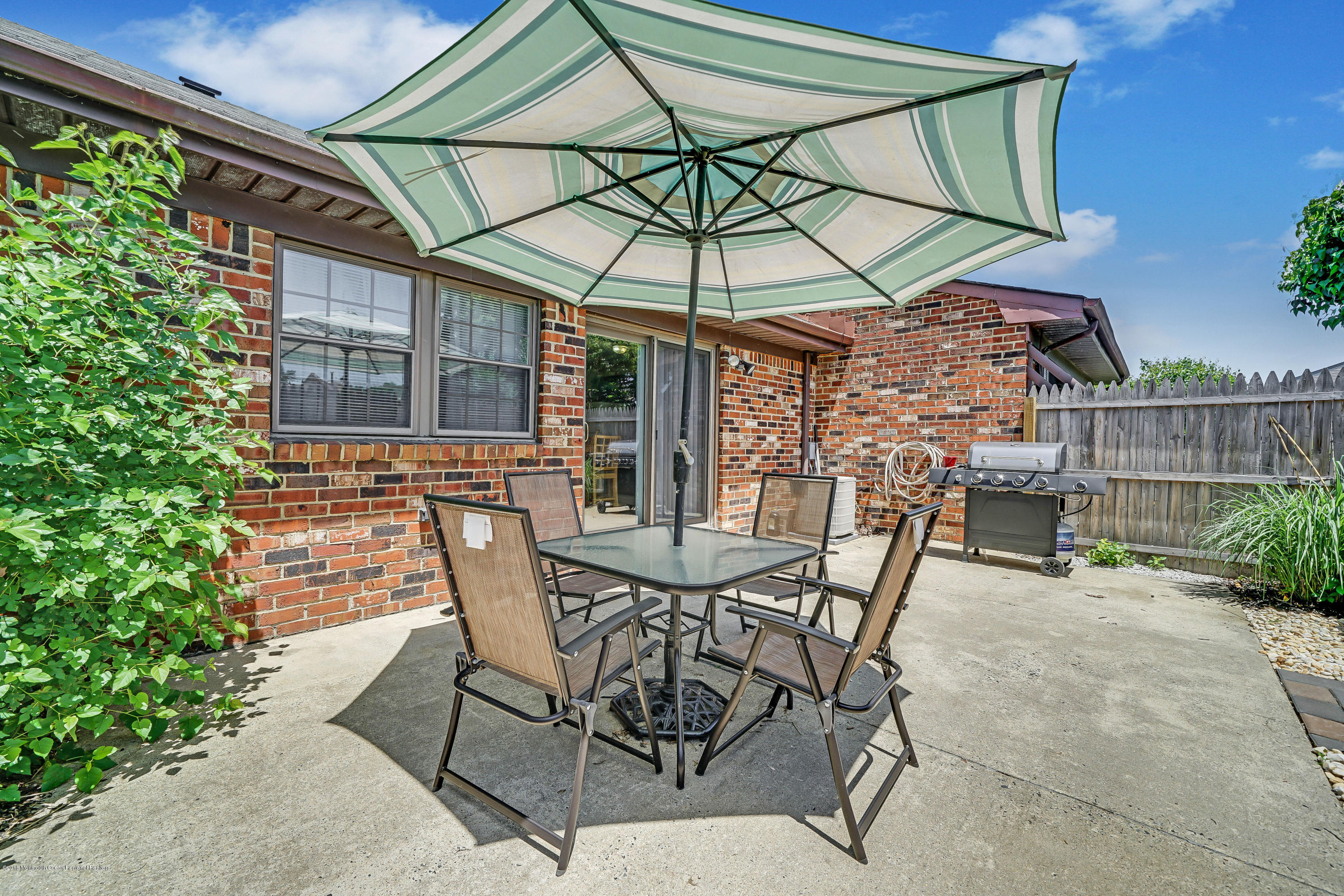 118 Greenwood Loop Road Brick, NJ 08724 - Photo 18 of 18 a view of a chair and table in the patio