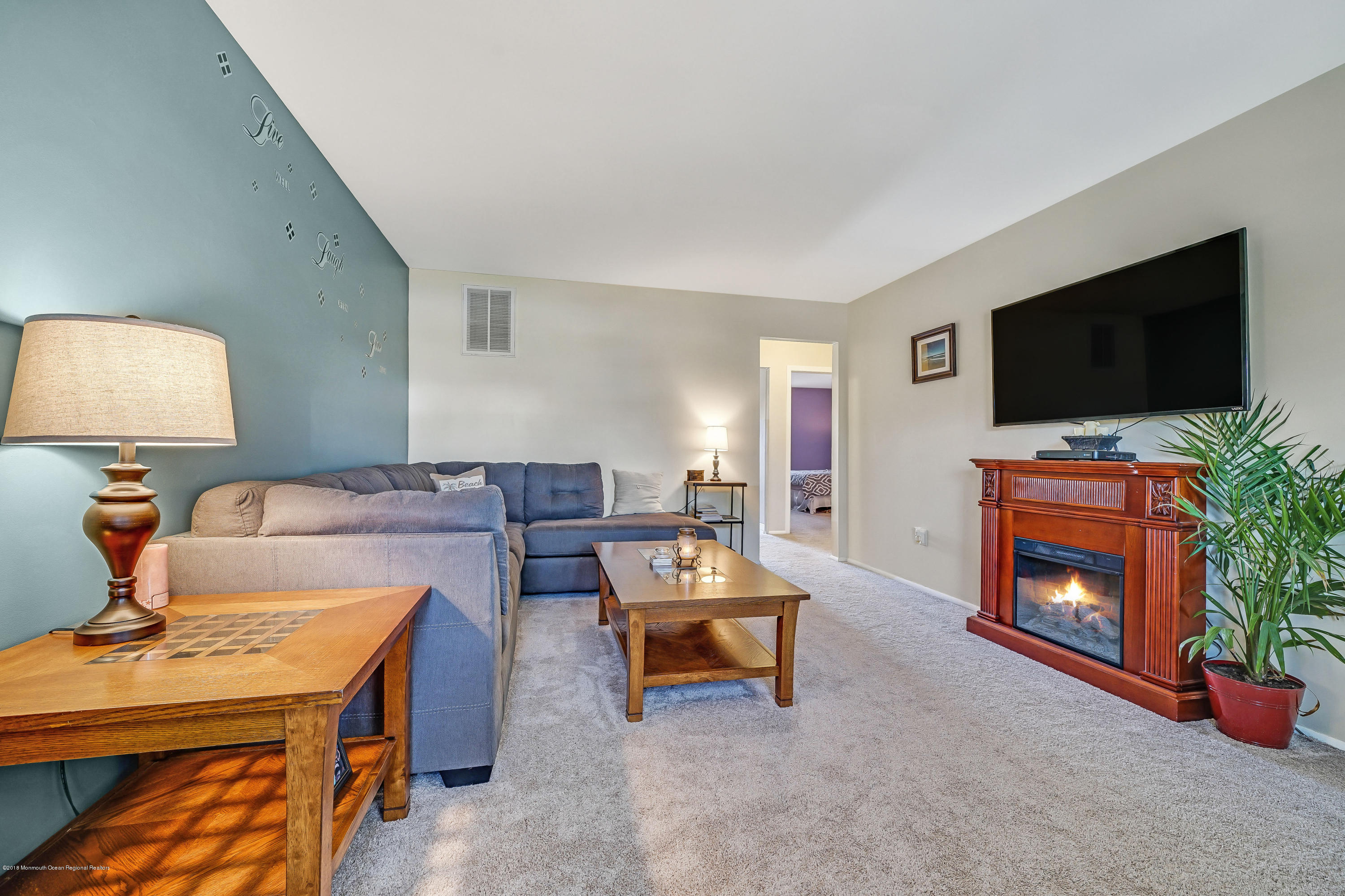 118 Greenwood Loop Road Brick, NJ 08724 - Photo 5 of 18 a living room with furniture and a flat screen tv