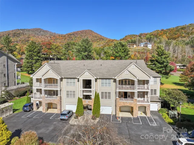 a view of a house with a mountain in the background