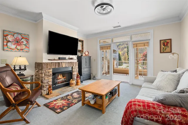 a living room with furniture fireplace and flat screen tv