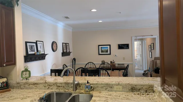 a view of a living room and dining room