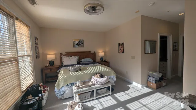 a bedroom with a bed and a table in it