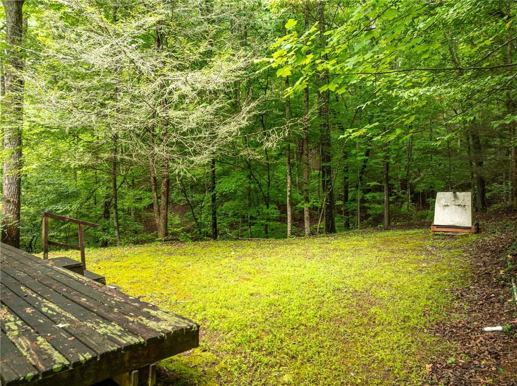 467 Gilliam Road Mineral Bluff, GA 30559 - Photo 19 of 36 a view of a swimming pool with an outdoor space and seating area
