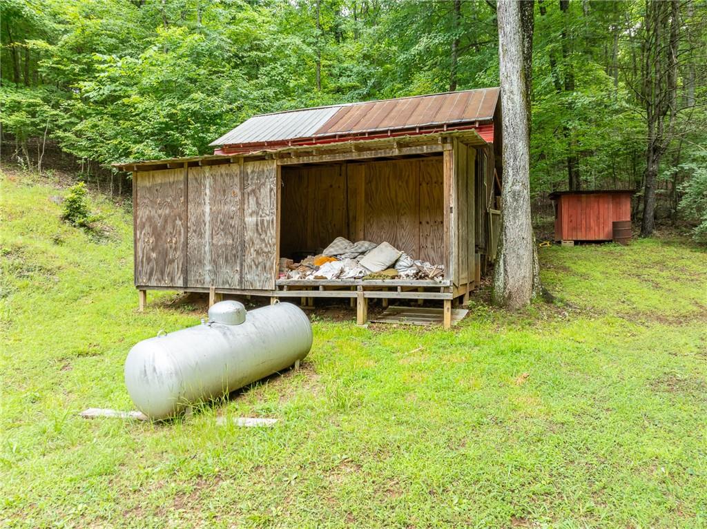 467 Gilliam Road Mineral Bluff, GA 30559 - Photo 22 of 36 a backyard of a house with seating space