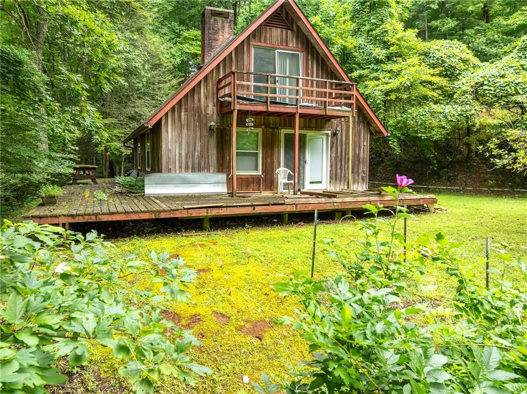467 Gilliam Road Mineral Bluff, GA 30559 - Photo 27 of 36 a view of a house with pool and sitting area