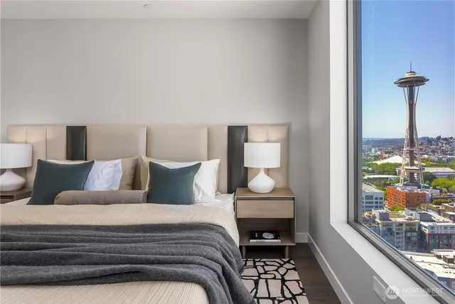 a bathroom with a granite countertop sink a shower and a mirror