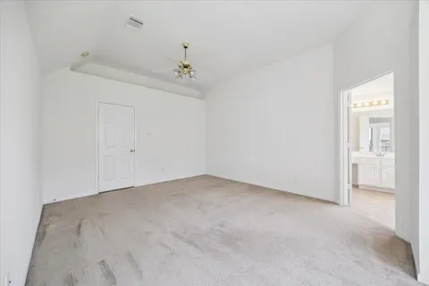 an empty room with a bathroom