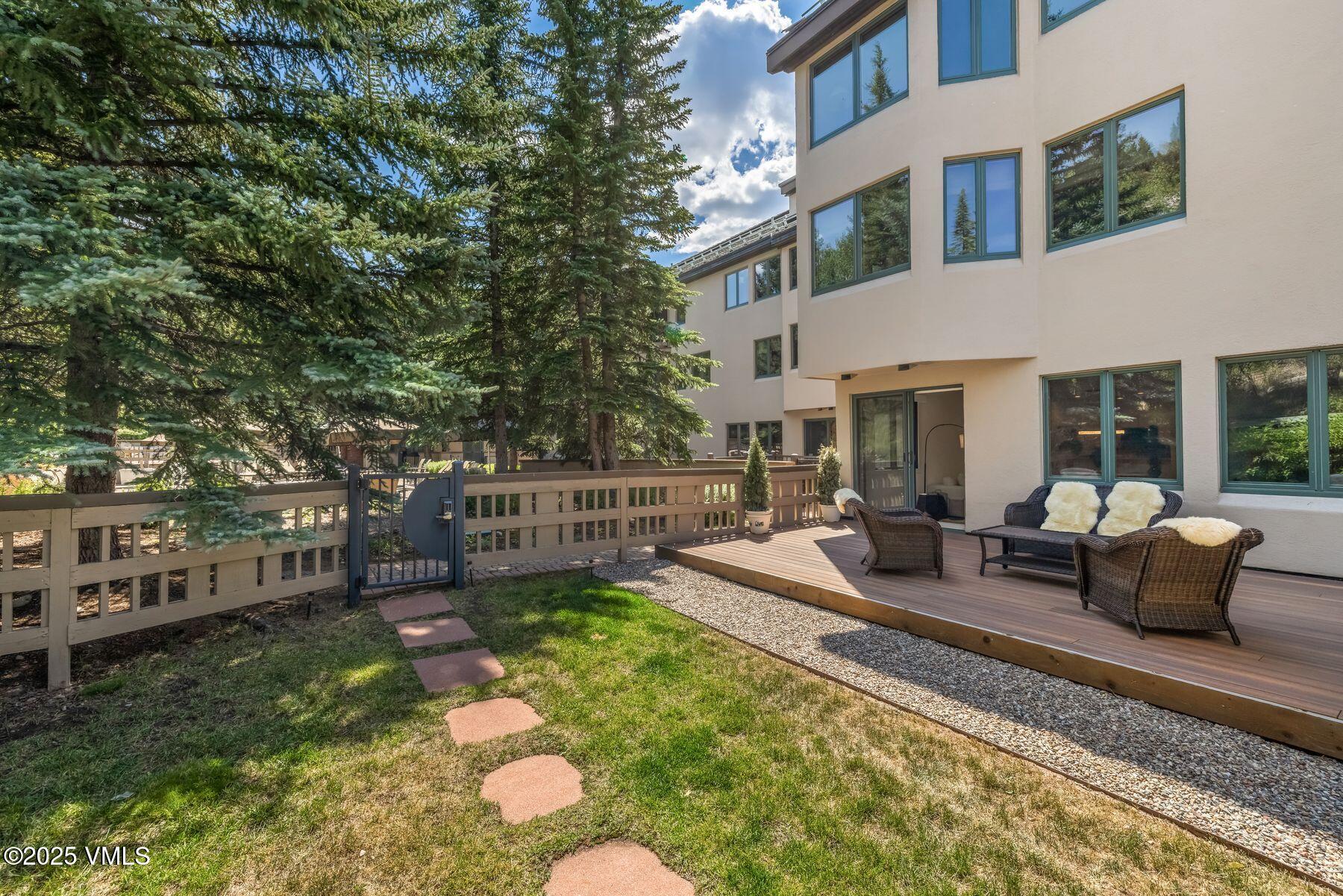 311 Offerson Road, Unit 232 Beaver Creek, CO 81620 - Photo 25 of 42 a view of a patio with couches table and chairs and potted plants