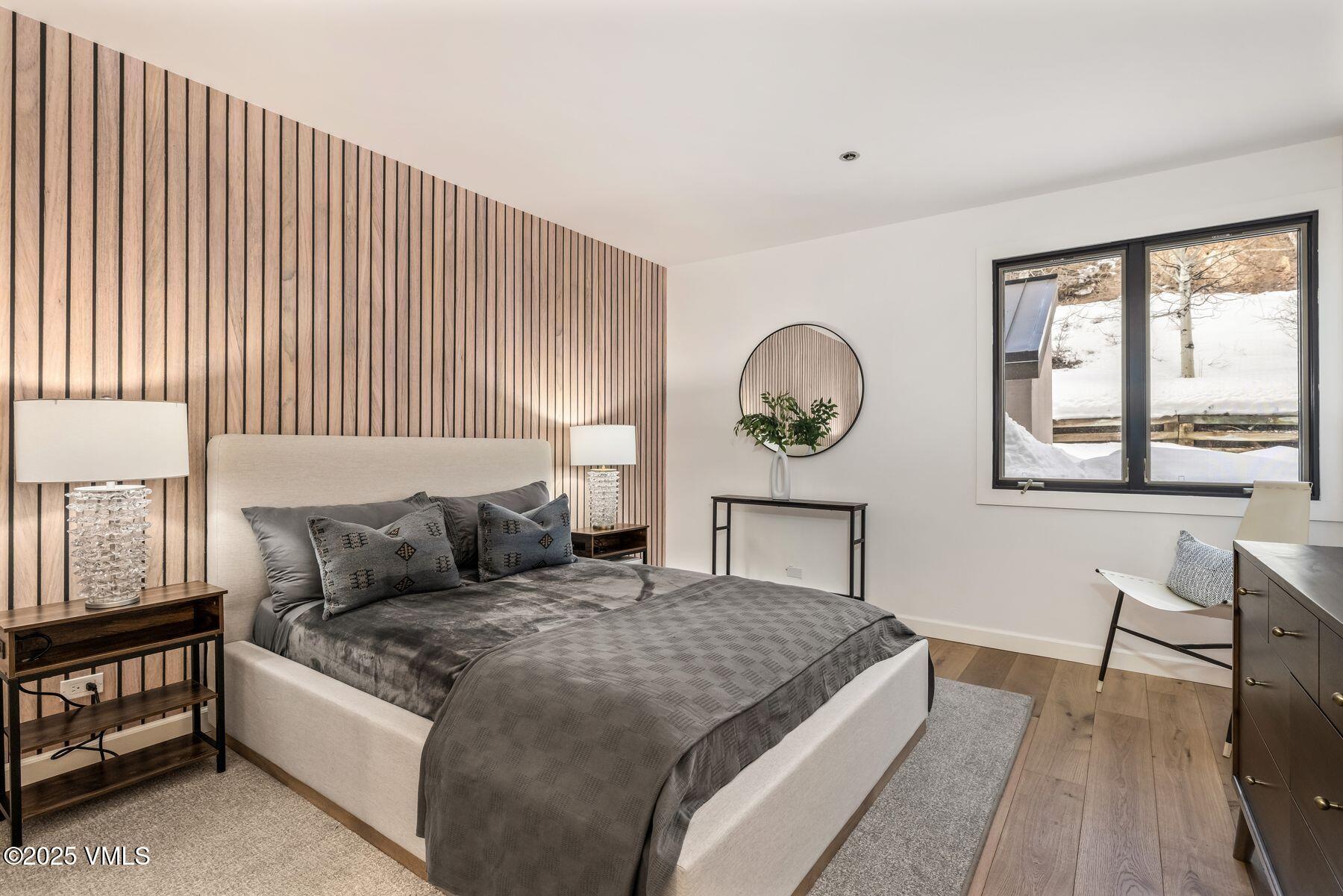 311 Offerson Road, Unit 232 Beaver Creek, CO 81620 - Photo 5 of 42 a living room with a bed furniture and a window