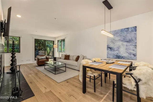 a living room with furniture and a table