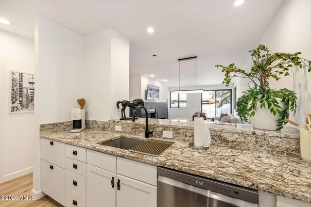 a kitchen with sink and window