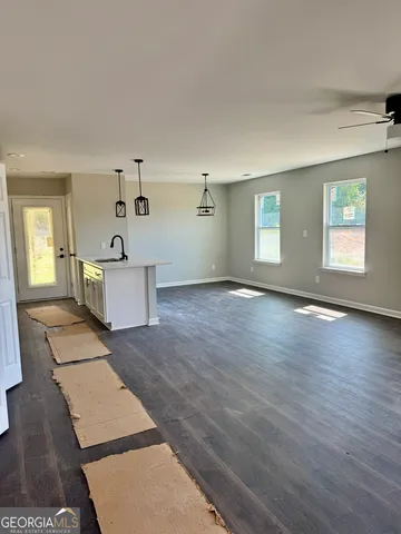 wooden floor with windows and hardwood floor