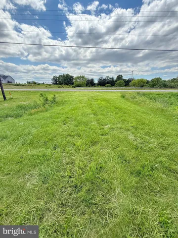 a view of an ocean and a yard