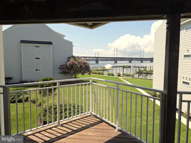 a view of balcony with wooden floor