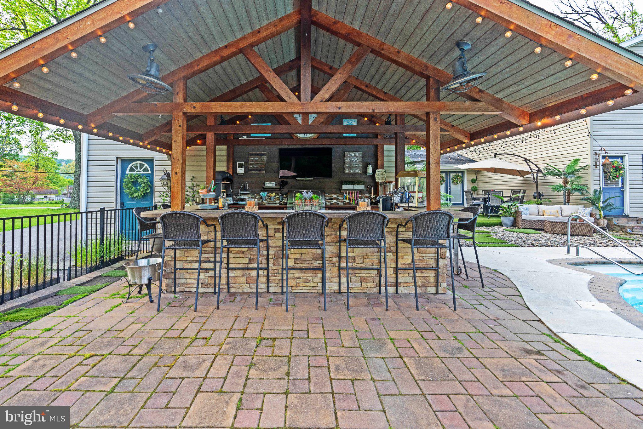 1002 Maple Lane Tyrone, PA 16686 - Photo 16 of 71 Charming outdoor bar with cozy ambiance.