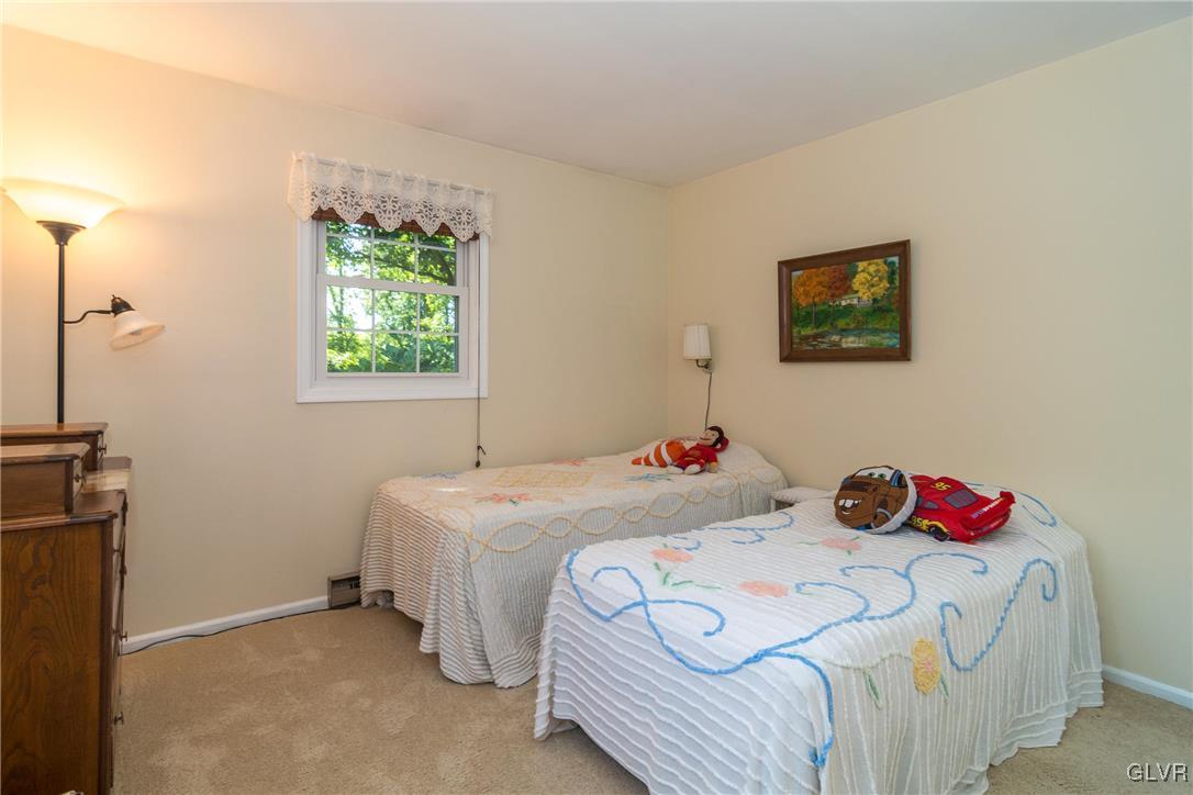 4127 Lower Saucon Road Hellertown, PA 18055 - Photo 11 of 28 a bedroom with a bed and a window