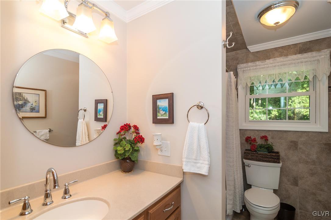 4127 Lower Saucon Road Hellertown, PA 18055 - Photo 13 of 28 a bathroom with a toilet sink and mirror