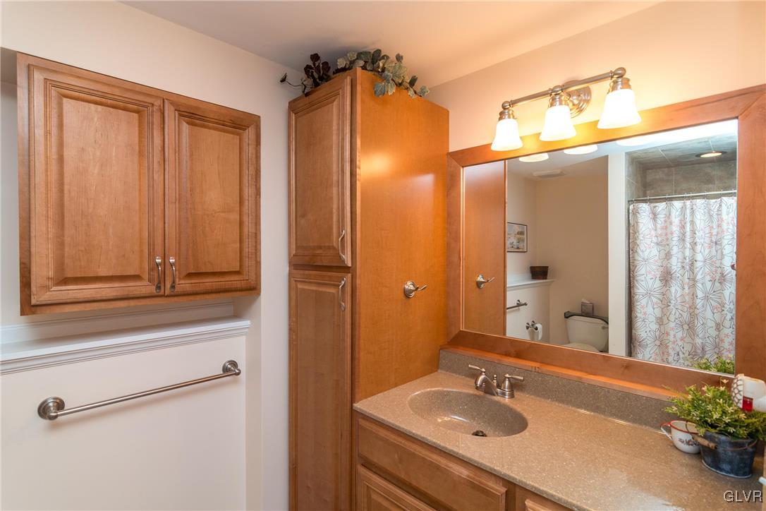 4127 Lower Saucon Road Hellertown, PA 18055 - Photo 18 of 28 a bathroom with a sink a vanity and a mirror
