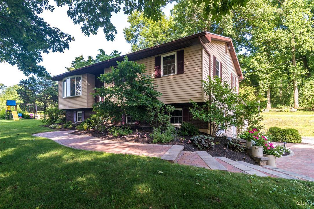 4127 Lower Saucon Road Hellertown, PA 18055 - Photo 2 of 28 a view of a house with a yard and sitting area