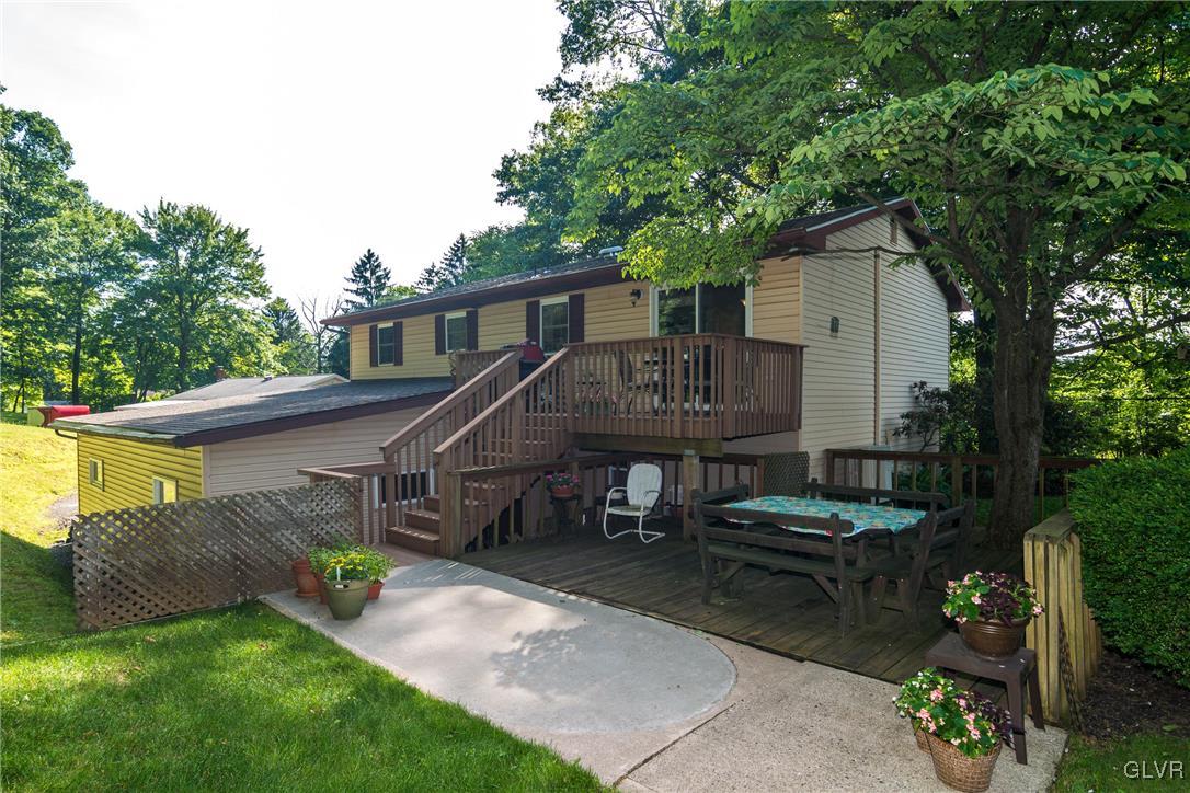 4127 Lower Saucon Road Hellertown, PA 18055 - Photo 23 of 28 a view of house with a chairs and table in a patio