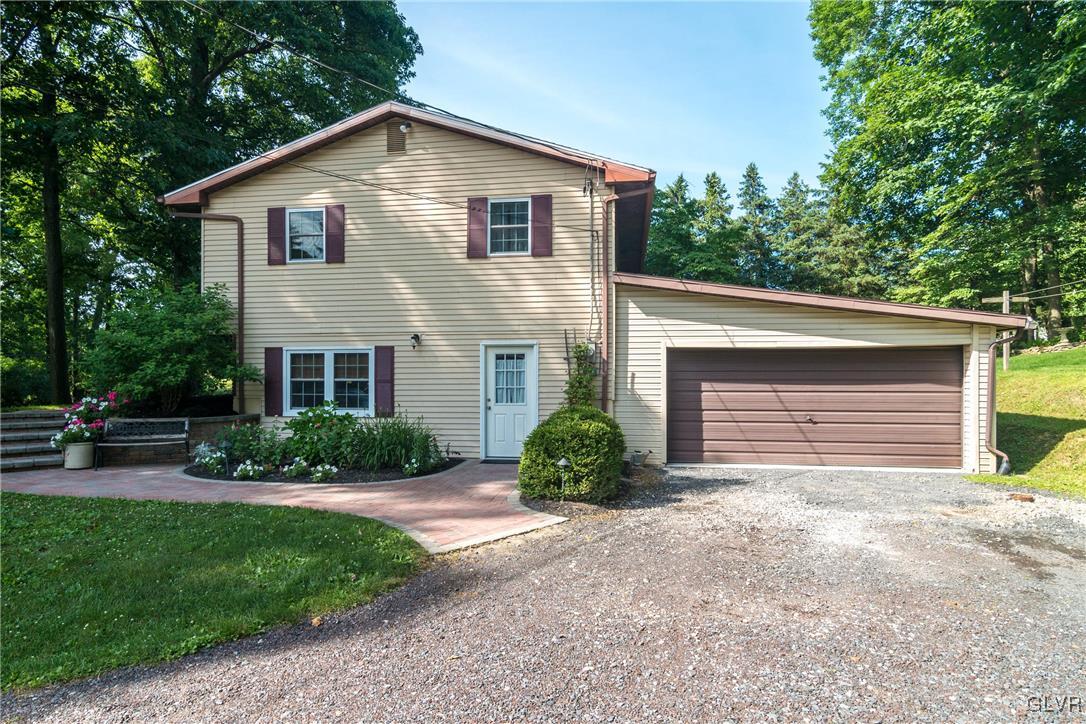 4127 Lower Saucon Road Hellertown, PA 18055 - Photo 27 of 28 a front view of a house with a yard and garage