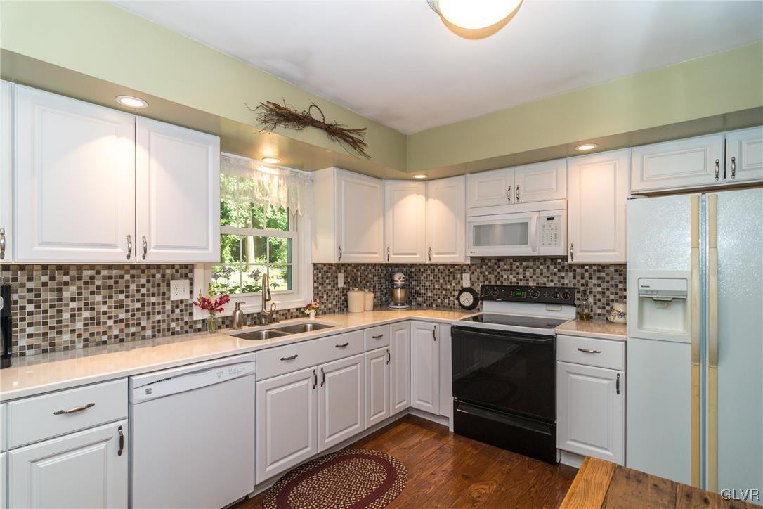 4127 Lower Saucon Road Hellertown, PA 18055 - Photo 8 of 28 a kitchen with white cabinets appliances and a sink