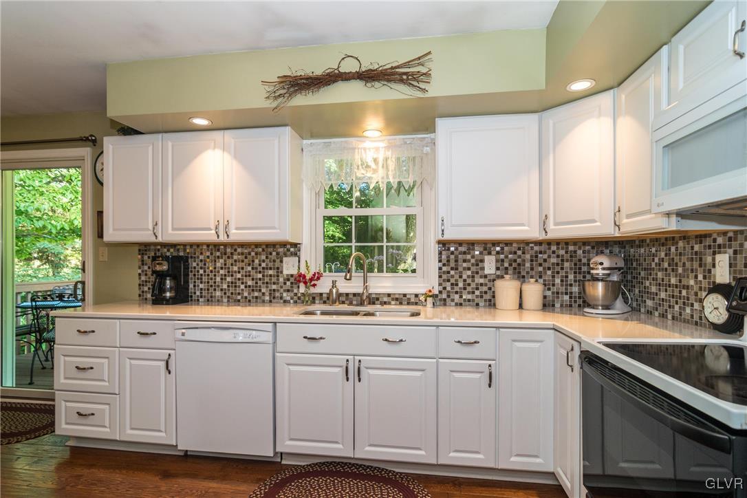 4127 Lower Saucon Road Hellertown, PA 18055 - Photo 9 of 28 a kitchen with white cabinets and white appliances