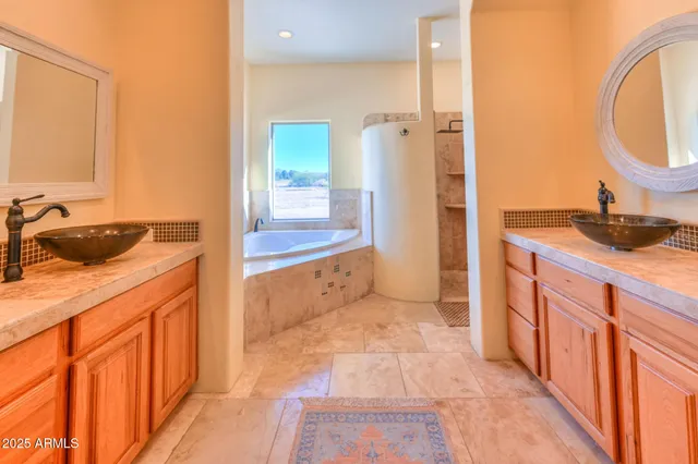 a spacious bathroom with a granite countertop sink and a mirror