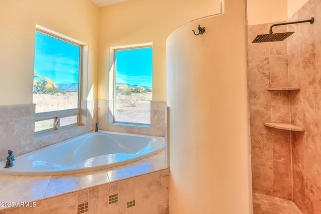a bathroom with a tub and shower