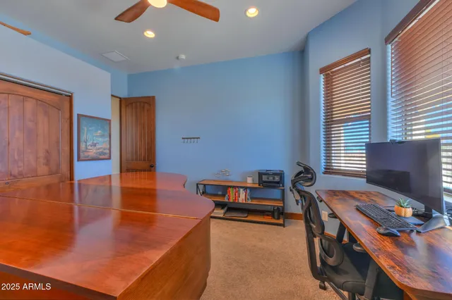 a reading room with furniture and a window