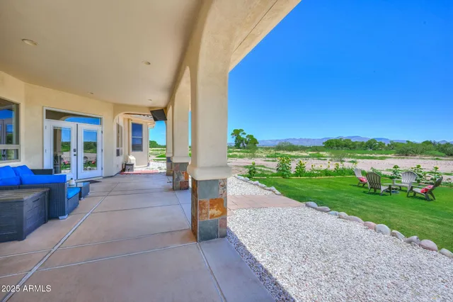 a view of a porch and garden