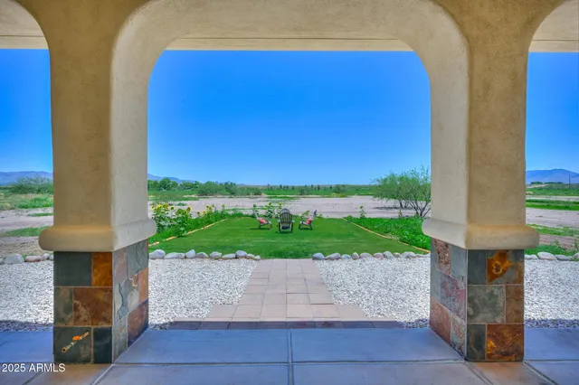 swimming pool view with a garden and plants