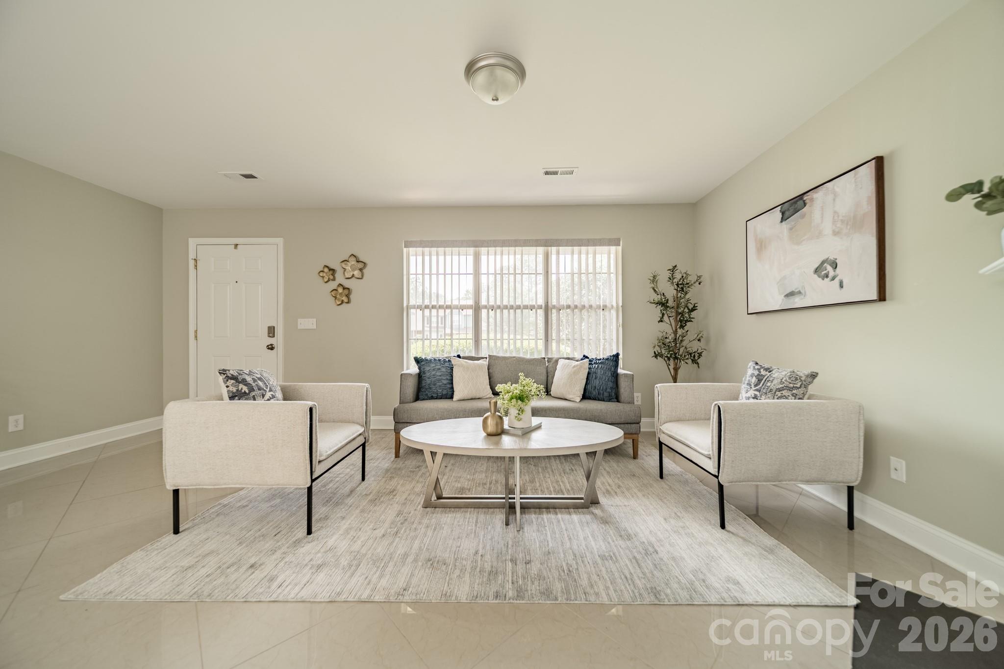 9226 Four Mile Creek Road Charlotte, NC 28277 - Photo 13 of 39 a living room with furniture and a large window