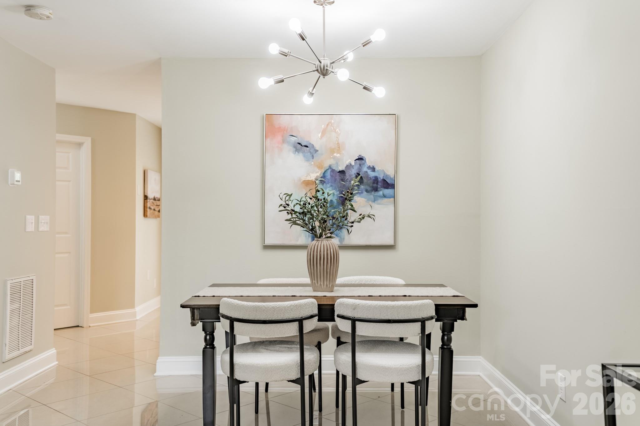9226 Four Mile Creek Road Charlotte, NC 28277 - Photo 15 of 39 a view of a dining room with furniture and a chandelier