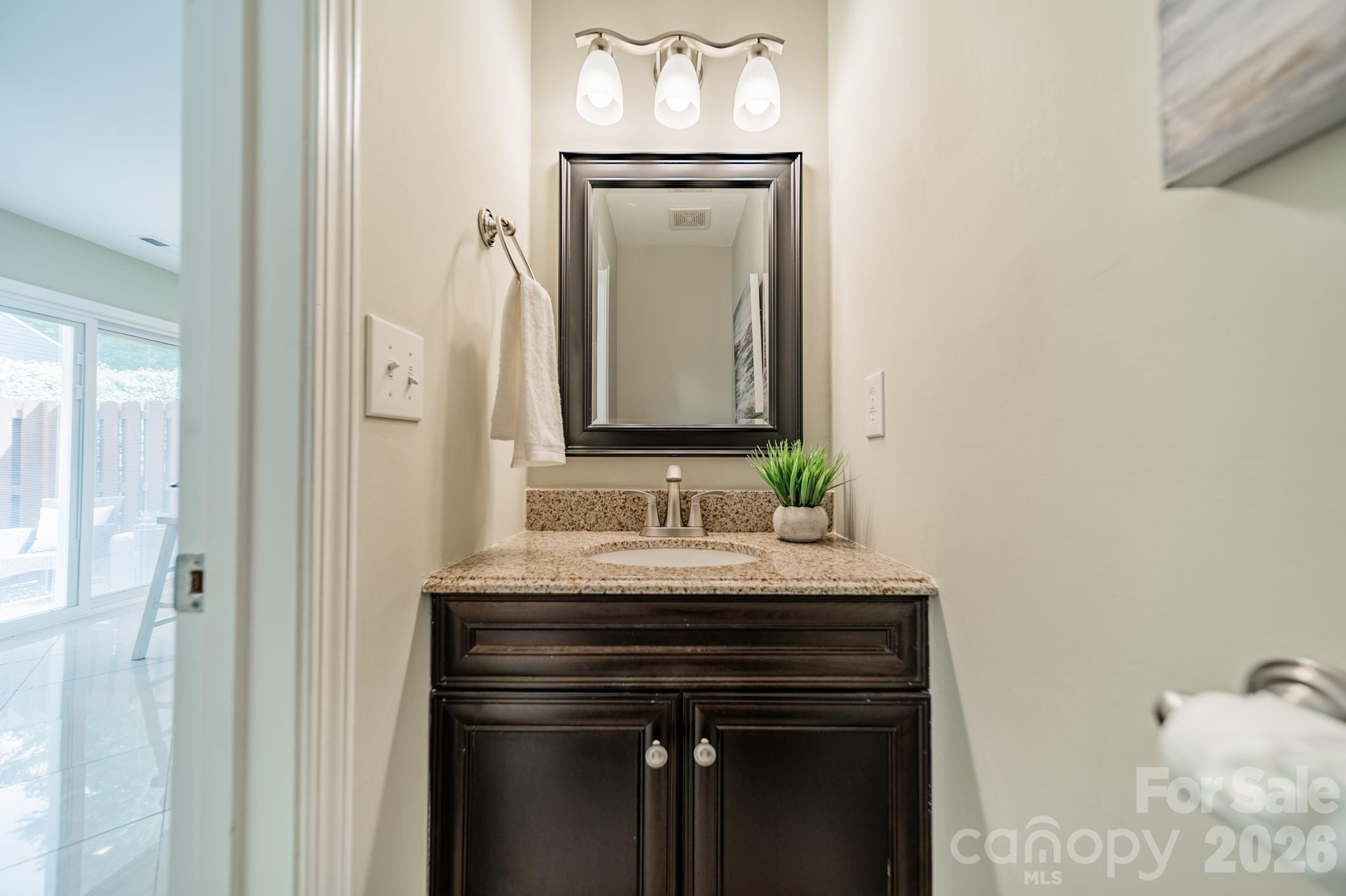 9226 Four Mile Creek Road Charlotte, NC 28277 - Photo 24 of 39 a bathroom with a sink and a mirror